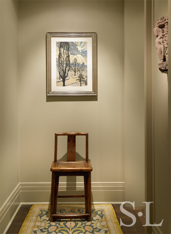Chicago high-rise apartment hallway showing artwork by Charles Burchfield and an Arts and Crafts runner