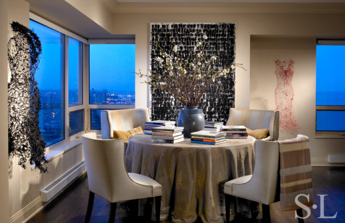 Chicago apartment dining area detail featuring artwork by Glenn Ligon and Keysook Geum