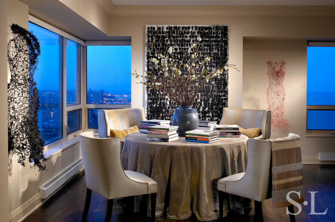 Chicago apartment dining area detail featuring artwork by Glenn Ligon and Keysook Geum