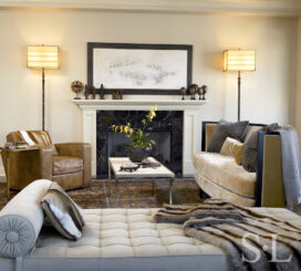 Chicago apartment living room fireplace seating area with artwork by Norman Lewis and lamps by Ingrid Donat