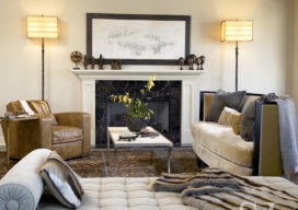 Chicago apartment living room fireplace seating area with artwork by Norman Lewis and lamps by Ingrid Donat