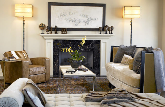 Chicago apartment living room fireplace seating area with artwork by Norman Lewis and lamps by Ingrid Donat