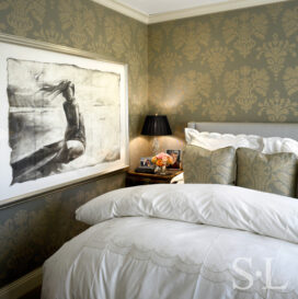 Chicago apartment bedroom with damask upholstered walls and artwork by Greg Lauren