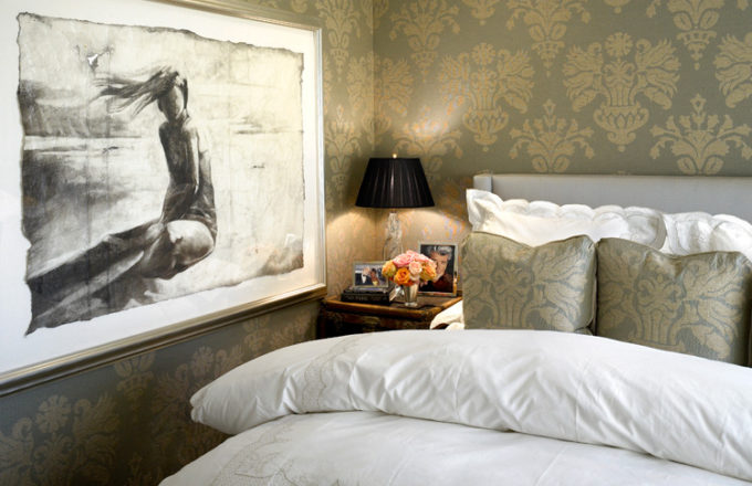 Chicago apartment bedroom with damask upholstered walls and artwork by Greg Lauren