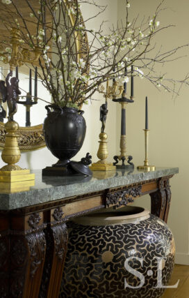 Entry detail featuring a rare Wedgwood vase atop a carved Italian console and ‘A Monumental Vessel’ by Per Weiss