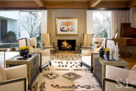 Living room view towards fireplace with artwork by Joan Miró and chairs by Ingrid Donat