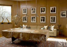 Den with American elm millwork, a grouping of George Hurrell photographs and a pool table with cowhide cover