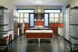 contemporary red, white and stainless steel kitchen in Chicago residence designed by Suzanne Lovell Inc.