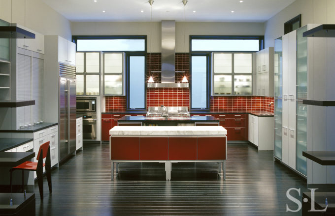 contemporary red, white and stainless steel kitchen in Chicago residence designed by Suzanne Lovell Inc.
