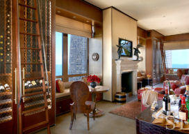 Chicago skyline penthouse kitchen seating area with fireplace