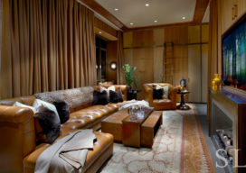 Chicago skyline penthouse media room with leather sofa