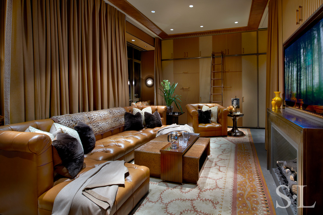 Chicago skyline penthouse media room with leather sofa