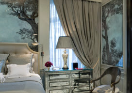 St. Regis NY owner’s suite bedroom detail with mirrored bedside tables, and mercury-glass lamps