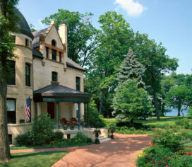 Front exterior view of restored landmark residence on former military base in Chicago’s North Shore overlooking Lake Michigan