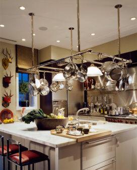 Chicago townhome kitchen with large pot rack over center island