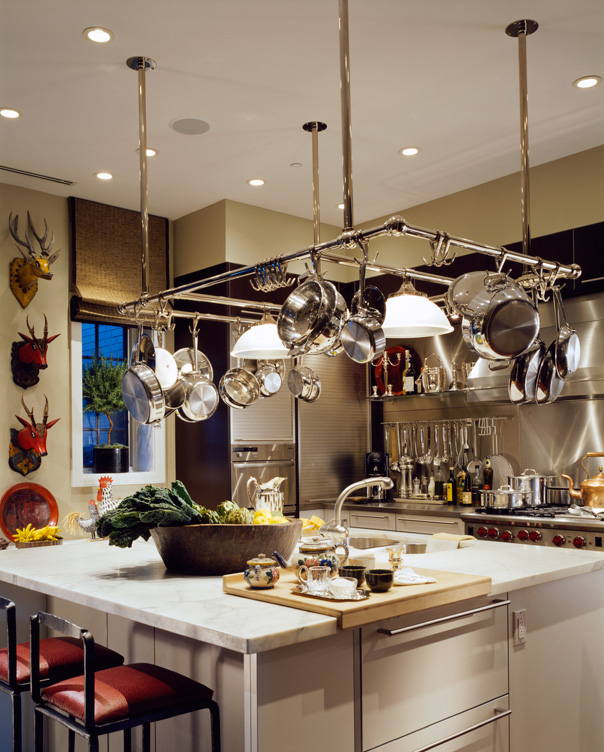 Chicago townhome kitchen with large pot rack over center island