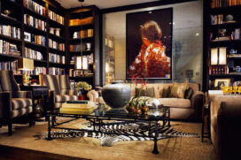 Chicago townhome library with Chanel sofa and artwork by Vik Muniz