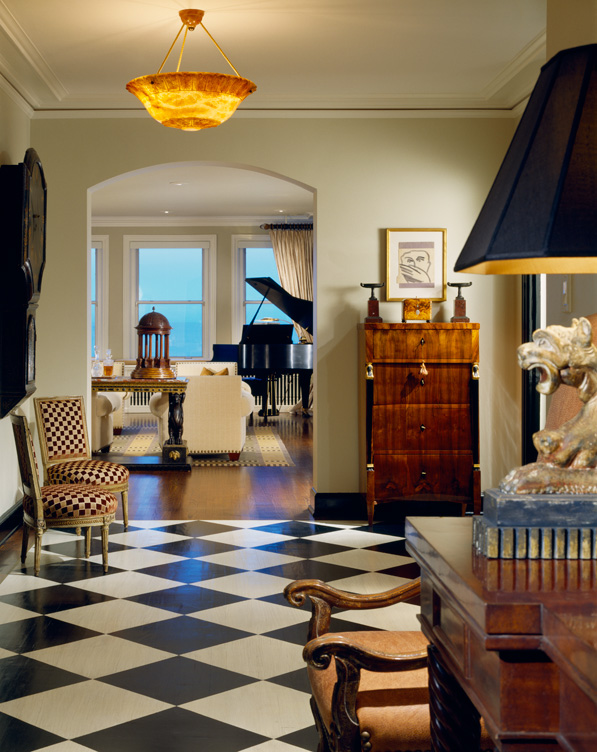1920s era Lake Shore Drive penthouse entrance hall with black and white checkerboard floor