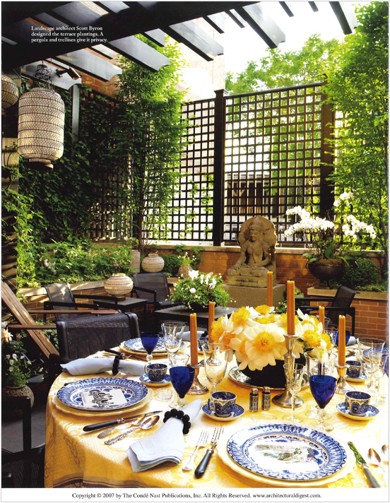 Magazine page showing terrace with a set table in Suzanne Lovell's Chicago town house