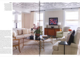 Luxe Chicago magazine spread showcasing living room designed in neutral palette with high-gloss plaster ceiling and views of Lake Michigan