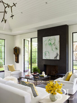 Contemporary residential interior view towards great room fireplace