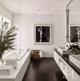 Master bath in black and white with artwork by Victor Skrebneski