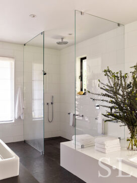 Master bathroom in black and white view of open shower