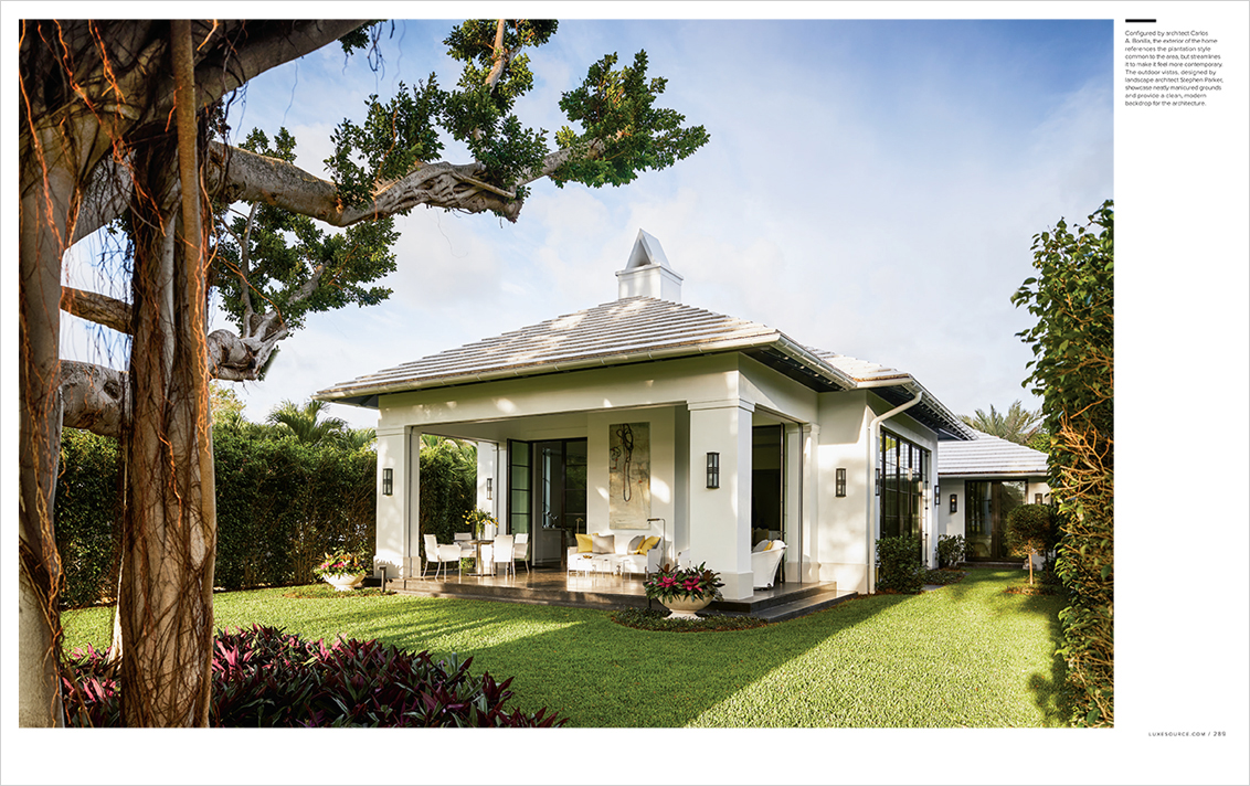 LUXE Magazine 2 page spread of Palm Beach golf cottage designed by Suzanne Lovell showing exterior view