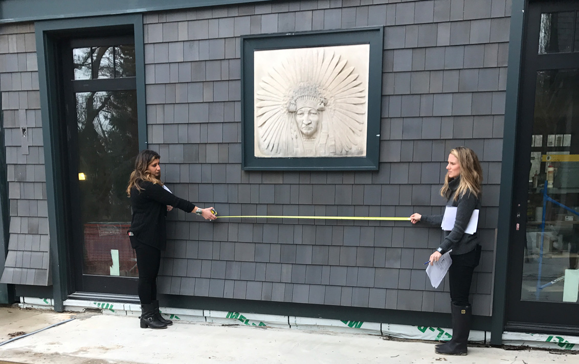 Designers from Suzanne Lovell Inc. take measurements at job site of lake house in Michigan