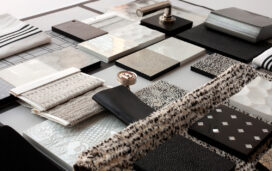 A black and white interior design palette of fabrics, rugs and hardware