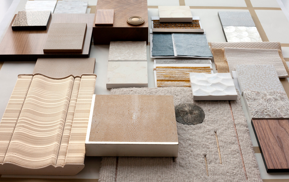 A neutral interior design palette of fabrics, rugs and hardware
