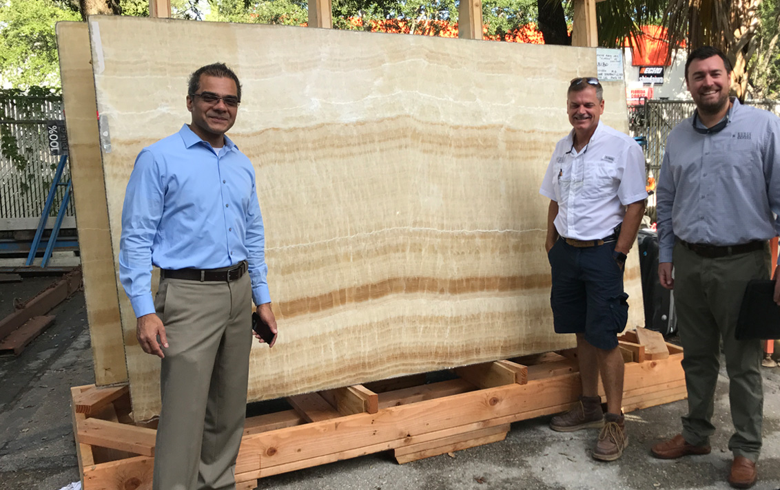Architect and builders selecting stone slabs for residence in Florida designed by Suzanne Lovell Inc.