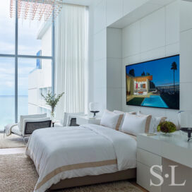 Master bedroom paneled with custom lacquered millwork and artwork by Tom McKinley