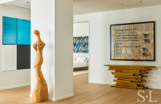 View outside of guest suite with artwork by Callum Innes and a console by Hervé van der Straeten