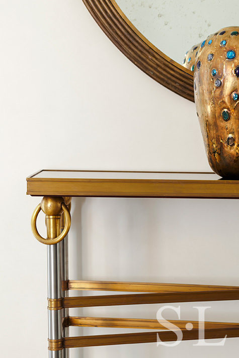Lakeview residence entry gallery detail of Maison Jansen Modernist console table