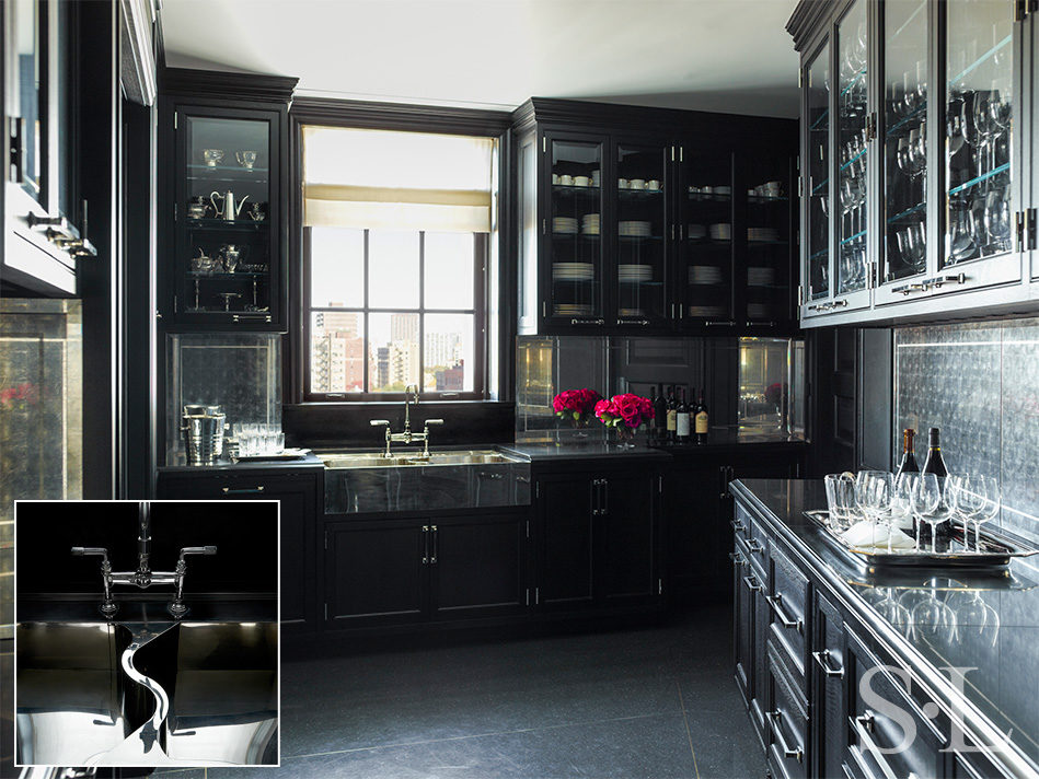 Butler’s pantry featuring a German Silver sink and black painted cabinetry