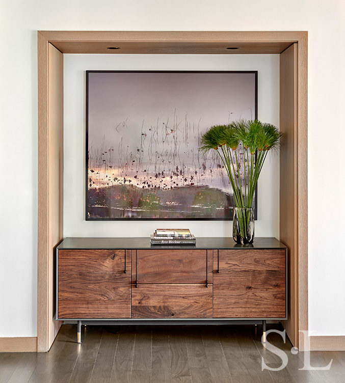Chicago luxury apartment residence niche detail with credenza and artwork by Ori Gersht