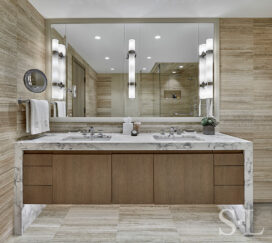 Bathroom vanity with oak millwork and a stone frame