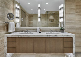 Bathroom vanity with oak millwork and a stone frame