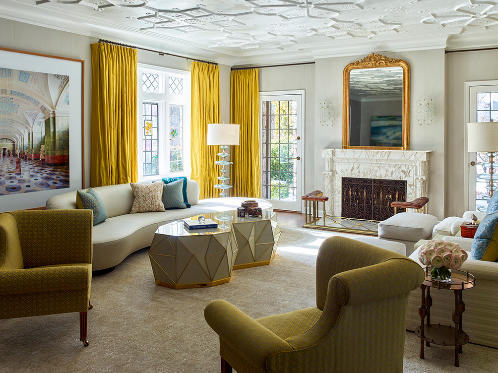 Scarsdale, NY residential living room renovation designed with curved sofa by Vladimir Kagan and glass and bronze inlay coffee table