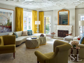 Scarsdale, NY residential living room renovation designed with curved sofa by Vladimir Kagan and glass and bronze inlay coffee table