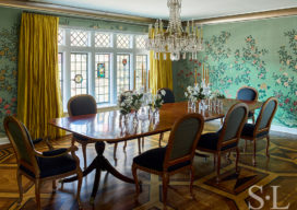 Scarsdale, NY dining room renovation with original leaded windows, large chandelier over table and floral wallpaper