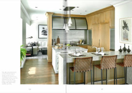 Book spread featuring a kitchen designed by Suzanne Lovell in a Chicago residence in neutral tones with a casual feel