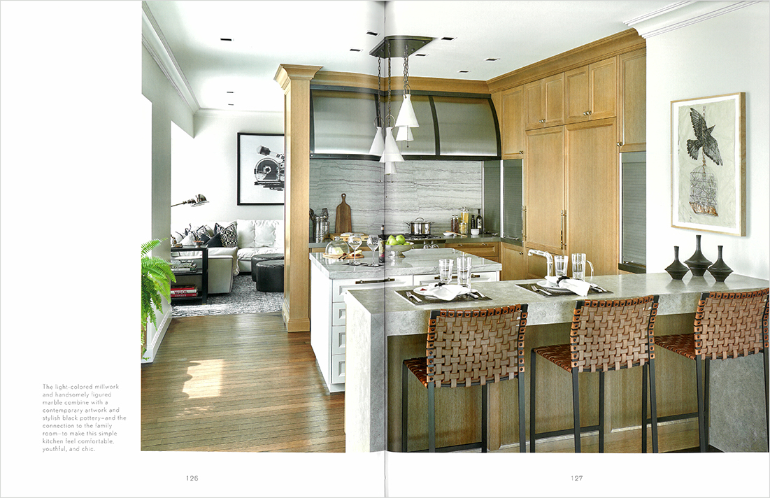 Book spread featuring a kitchen designed by Suzanne Lovell in a Chicago residence in neutral tones with a casual feel