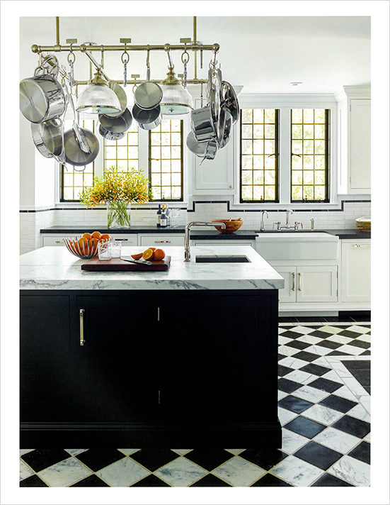 Book page featuring a kitchen designed by Suzanne Lovell in a Scarsdale NY residence in graphic black and white