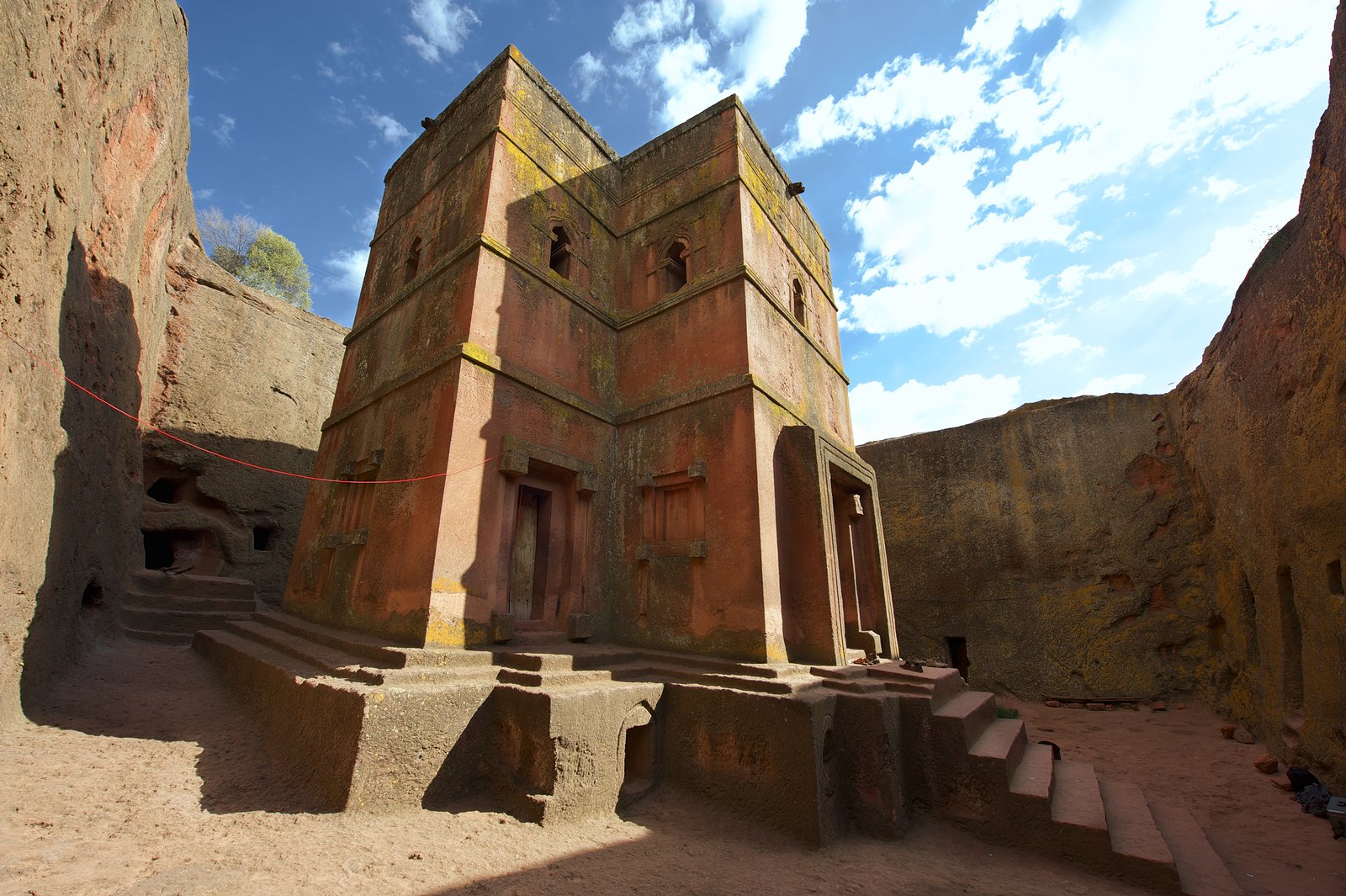 Priest in Bet Danaghel Church holding the Cross of King Lalibela. The  rock-hewn churches of Lalibela make it one of the greatest  Religio-Historical sites not only in Africa but in the Christian