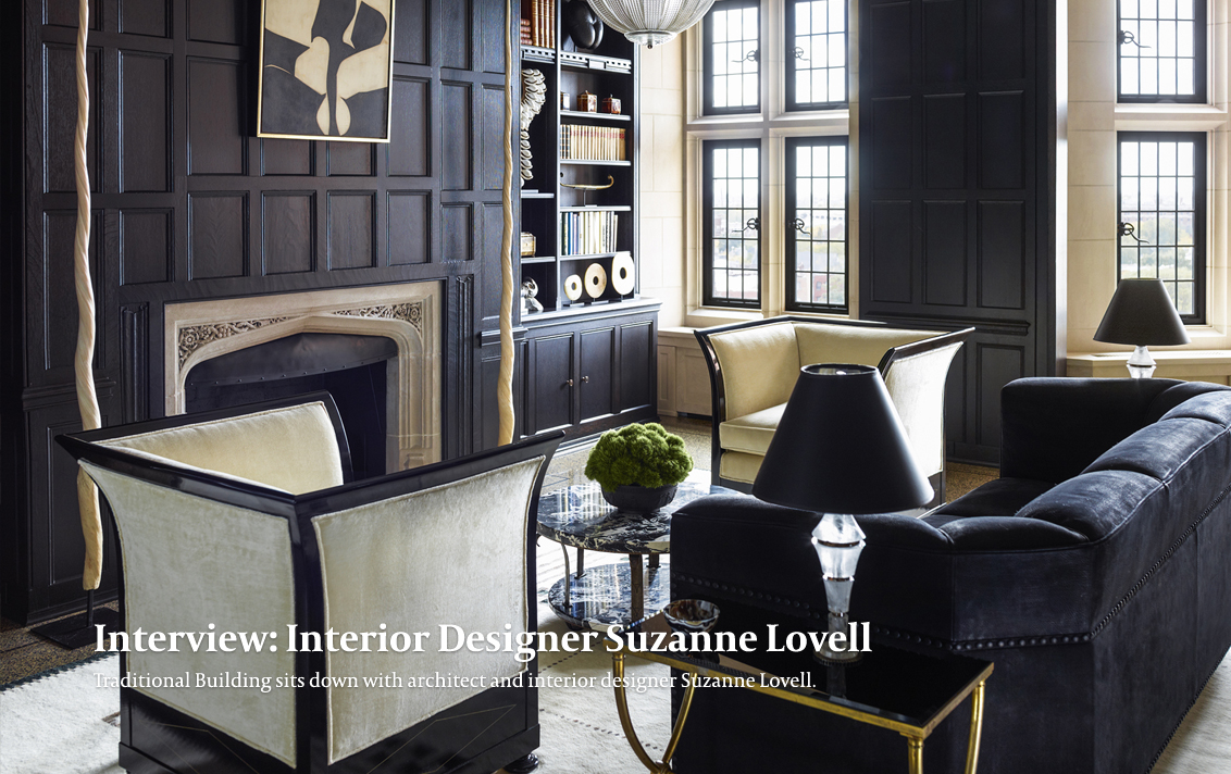 Library with dark wood paneling in Lakeview Residence designed by Suzanne Lovell