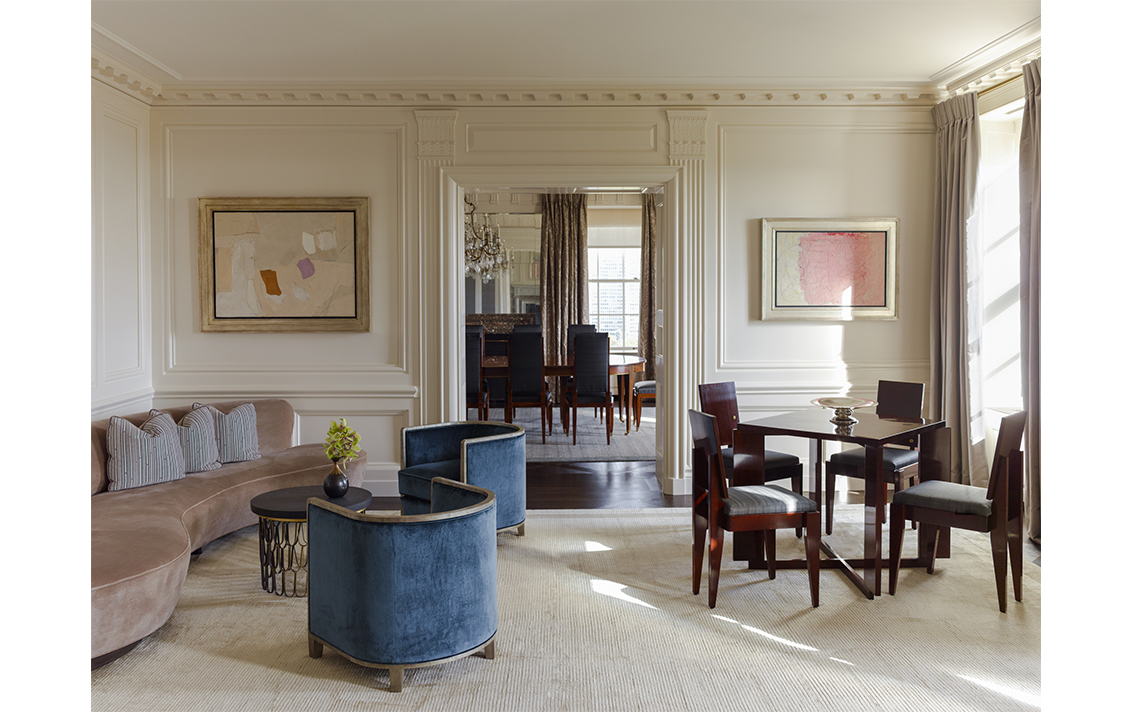 Living room view towards dining room in Lakeview Residence designed by Suzanne Lovell