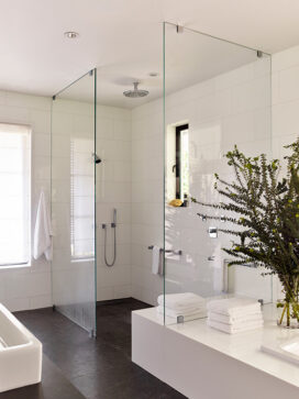 Master bathroom in black and white view of open shower