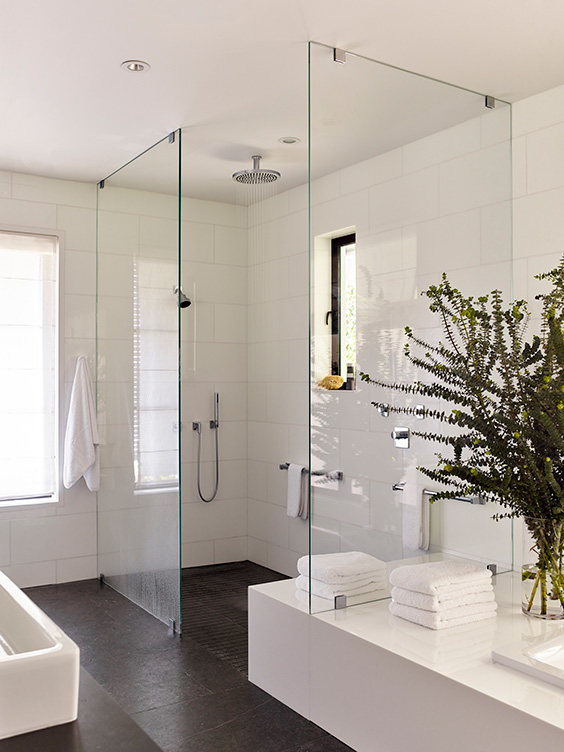 Master bathroom in black and white view of open shower